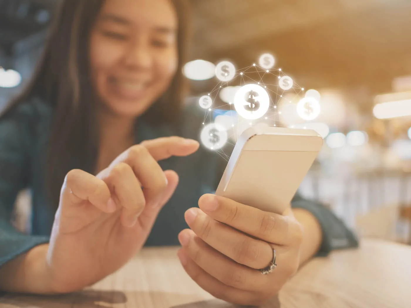 Asian woman hand using mobile phone with online transaction application.