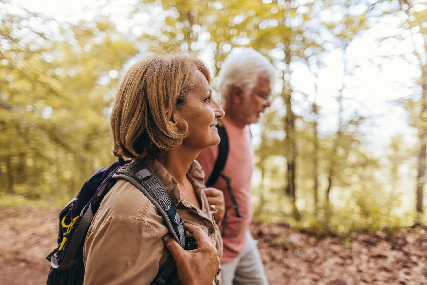 Senior couple hiking together in the forest