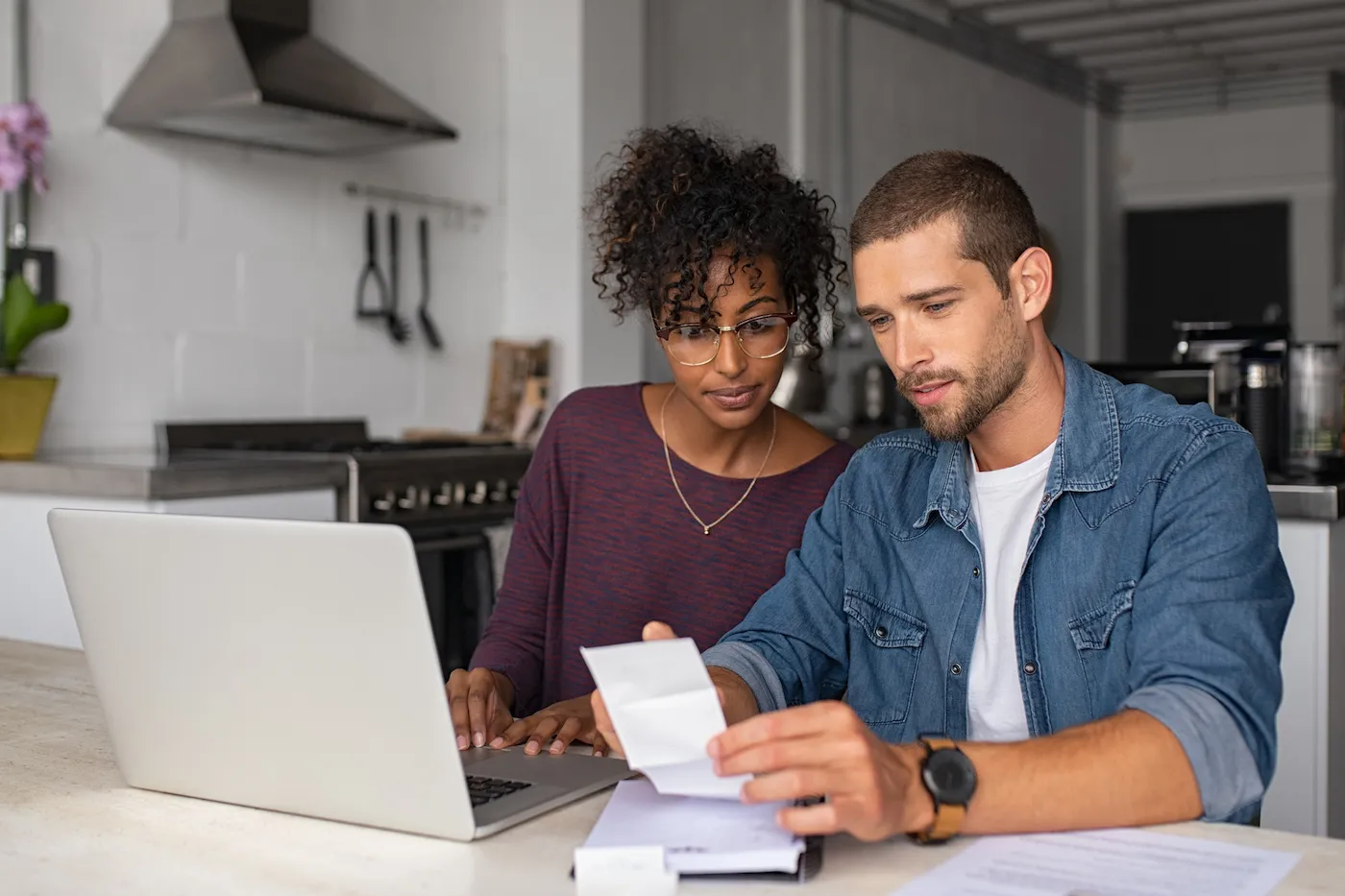 Young couple examining home finance