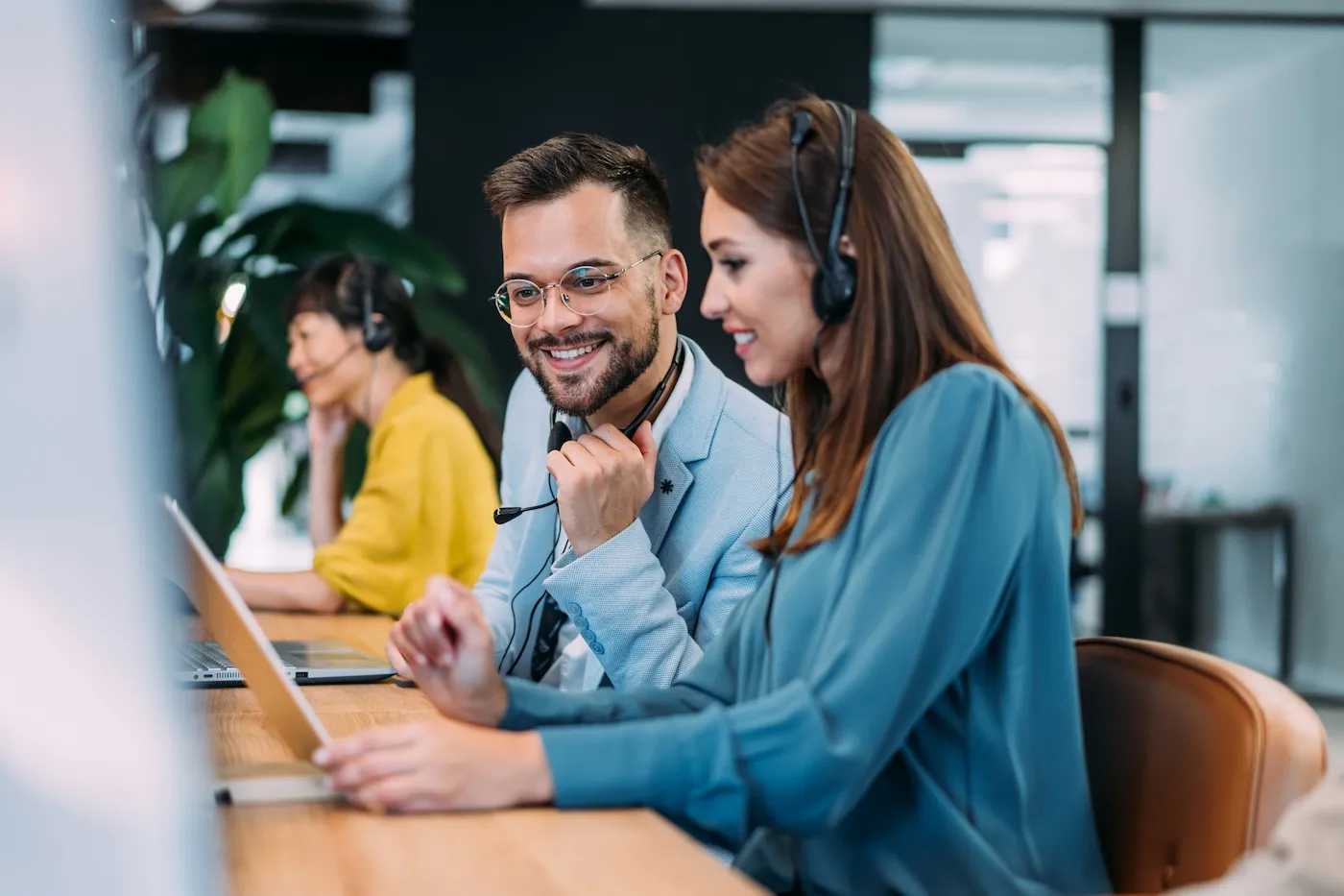 Shot of call center operators working in the office.