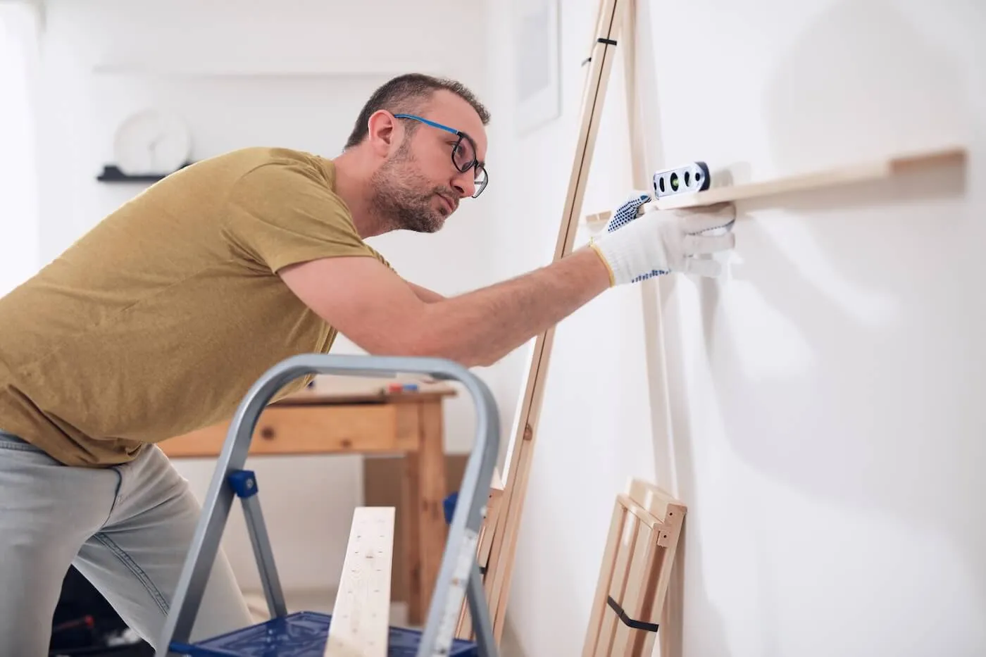 Mature man remodeling the house