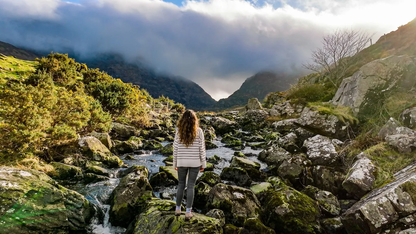 The Gap of Dunloe (from Irish: Dún Lóich, meaning 'Lóich's stronghold'), also recorded as Bearna an Choimín (meaning "gap of the commonage" or "gap of the little hollow"), is a narrow mountain pass running north-south in County Kerry, Ireland, that separates the MacGillycuddy's Reeks mountain range in the west, from the Purple Mountain Group range in the east.