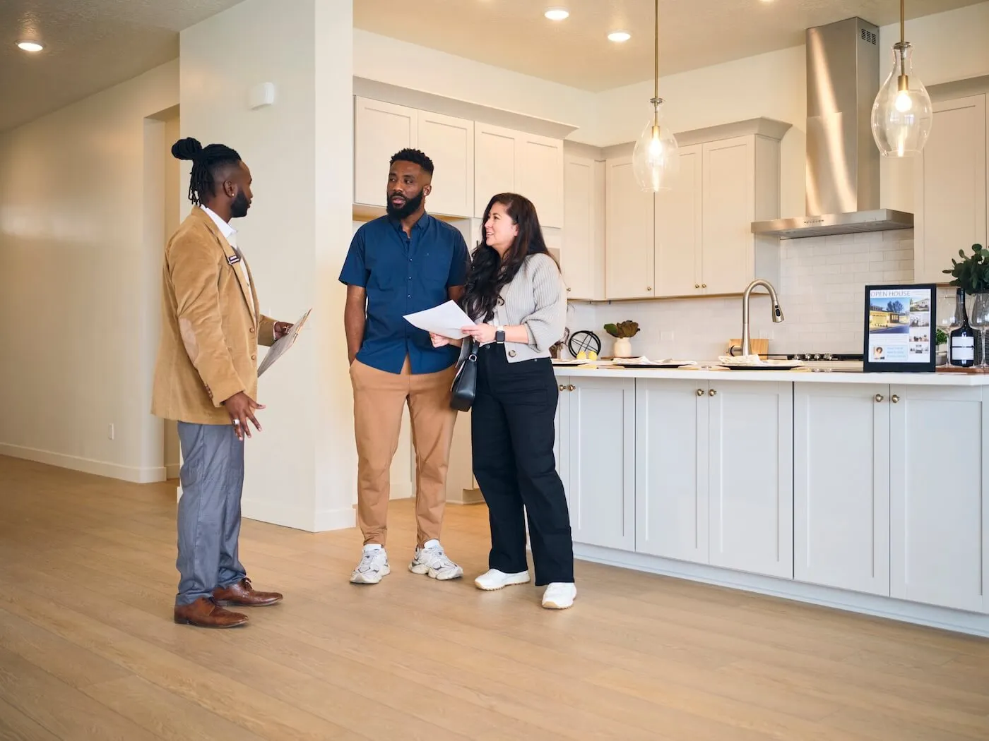 Real Estate Agent Showing a New Home to Prospective Buyers