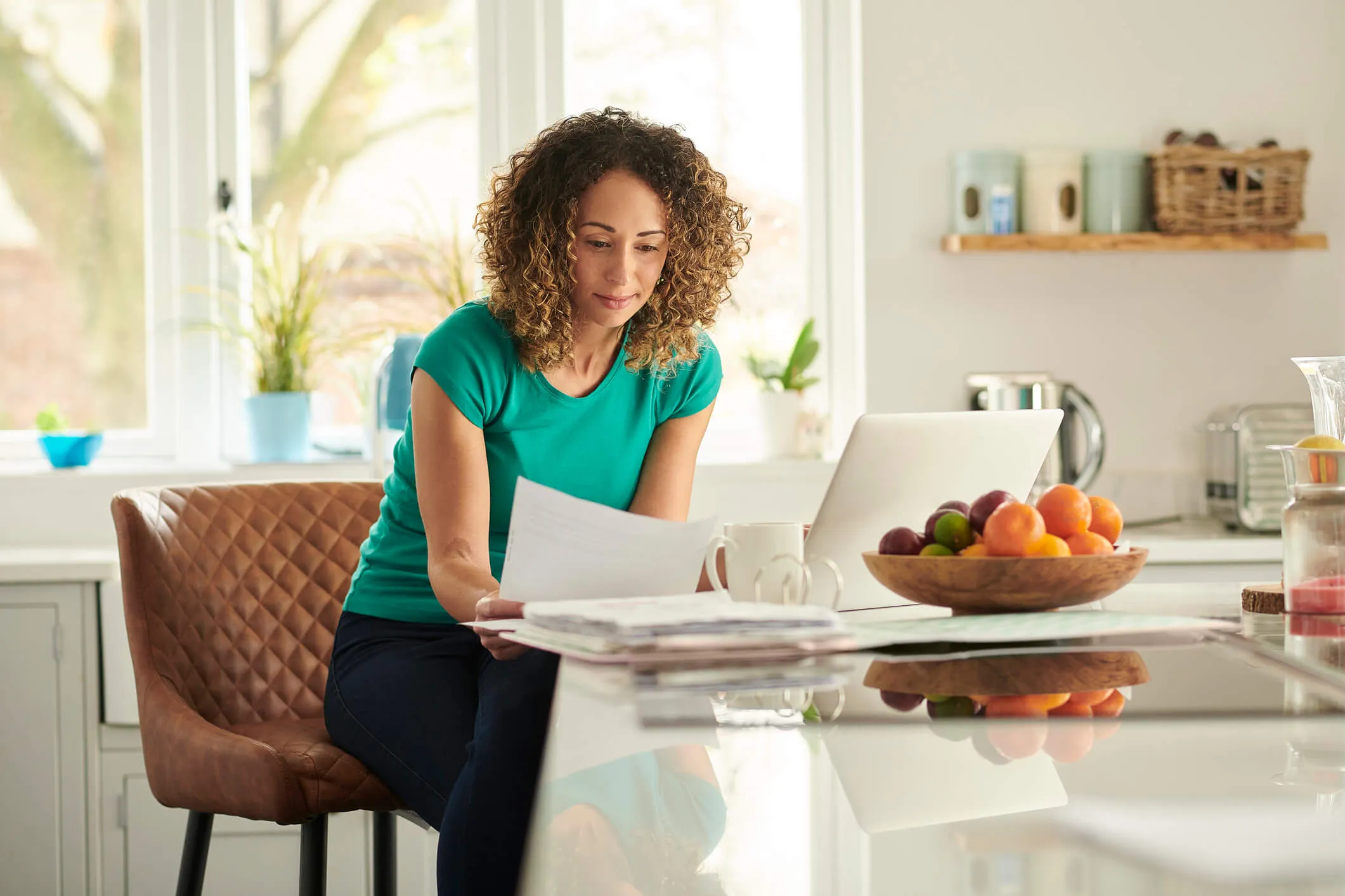 Woman paying taxes online at home