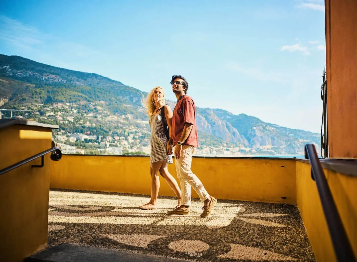 Happy young couple enjoying their vacation in an old Mediterranean town