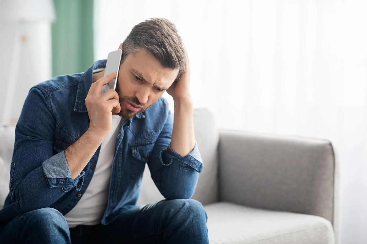 Concerned man making a phone call