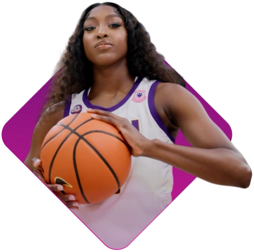 Flau’jae Johnson is holding a basketball ball.