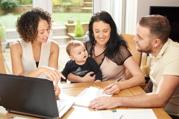 Clients meeting with an advisor from a wealth management firm.