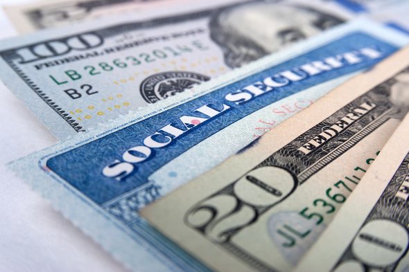 A Social Security card and paper currency.