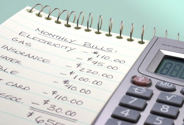 A budget written on a notepad.