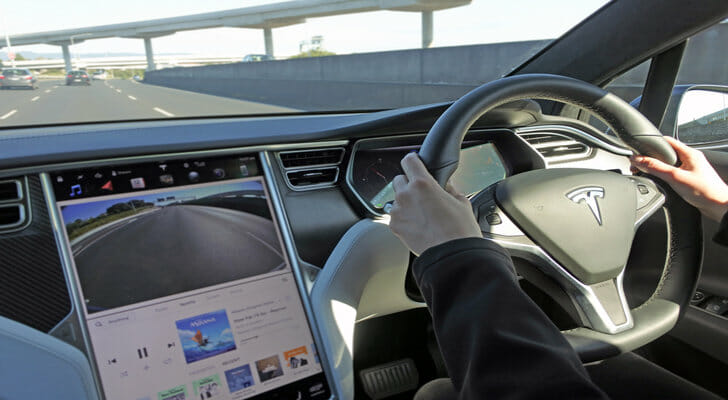 A driver taking their Tesla for a drive.