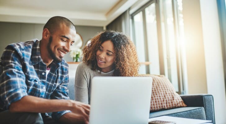 A couple research how to invest $100,000.