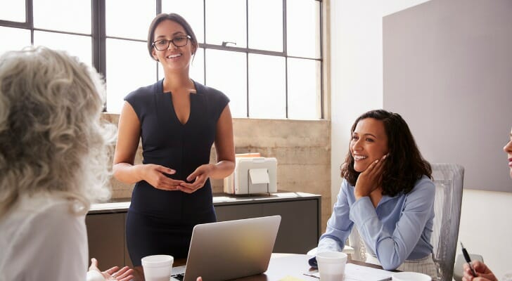 Trust company officials work with a client.