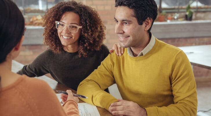 A certified credit counselor with clients.