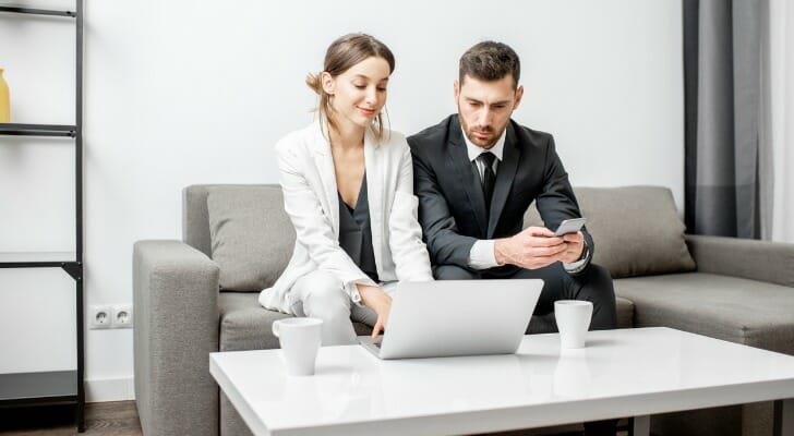 A home-owning couple considers refinancing their mortgage.