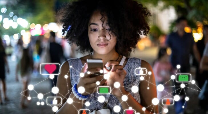 Young person engaged in social investing