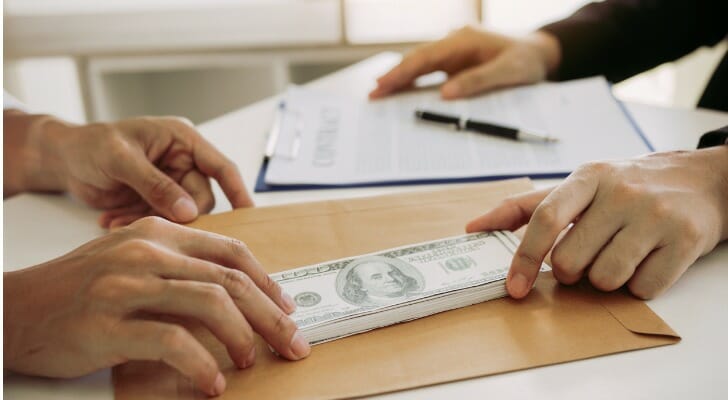 Money exchanging hands.