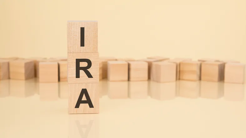 Wooden blocks spelling out "IRA."