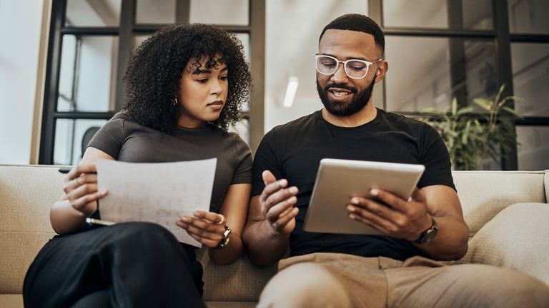 A couple reviews the investments in their retirement portfolios.