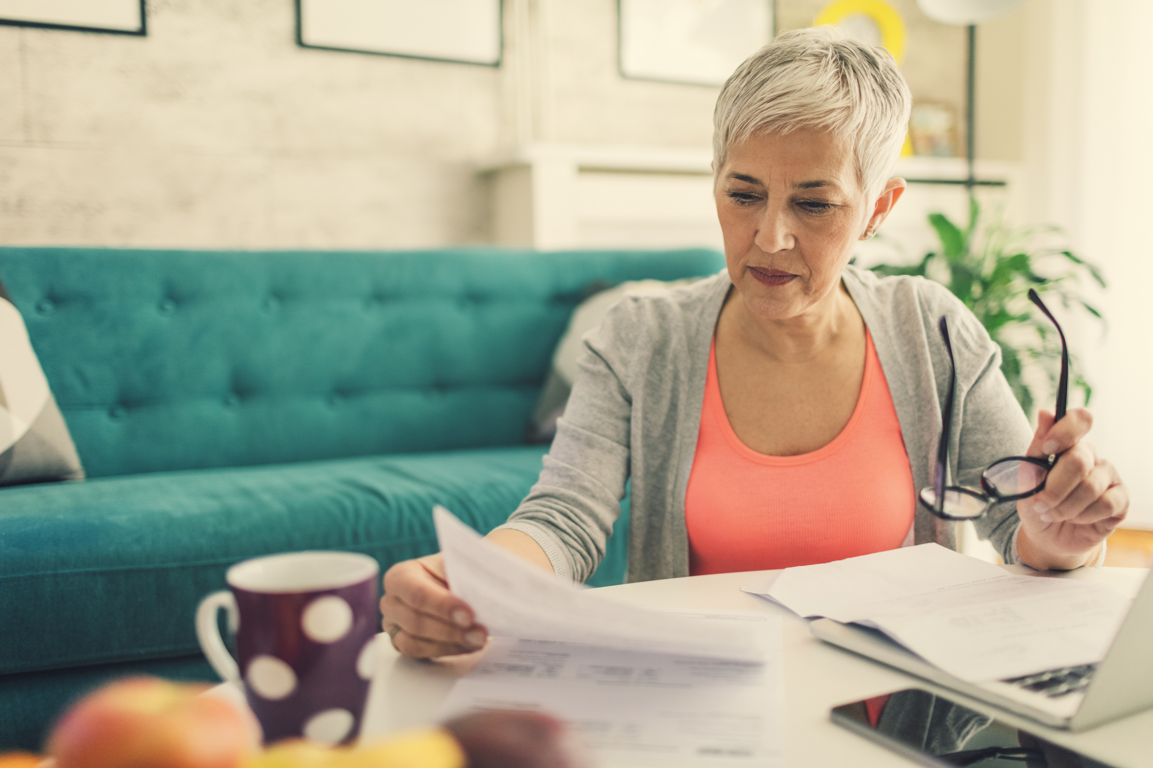 A woman calculating how much she may owe in gift taxes.