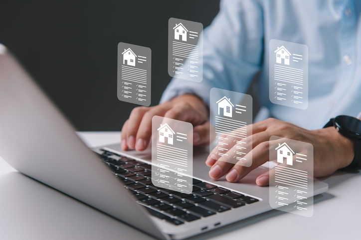 A man evaluating two real estate options.