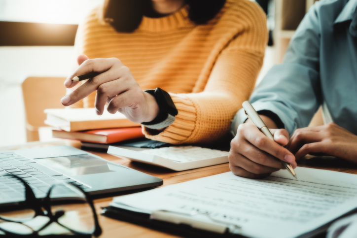 An advisor and client working on an investment plan.