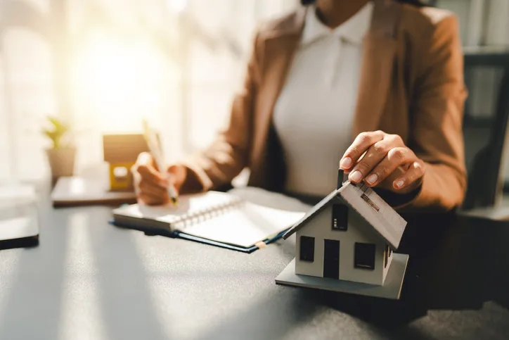 Real estate agent preparing paperwork.