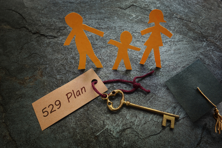 Paper family with 529 Plan written on a label.